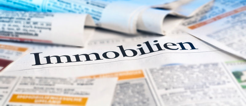 A newspaper with real estate ads