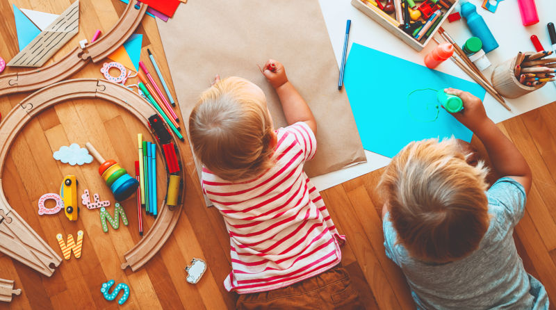 Kids playing and drawing in a daycare center