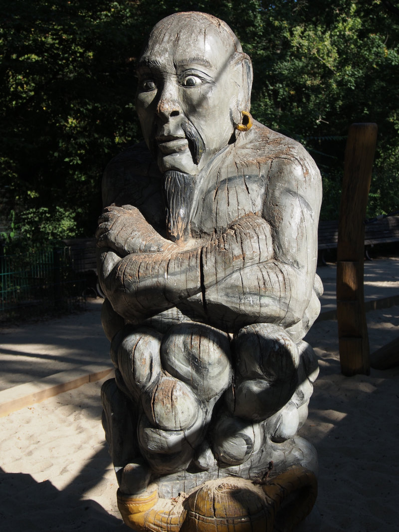 Wooden Alladin sculpture on the playground in Berlin