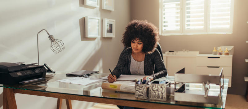A woman sitting behind a desk