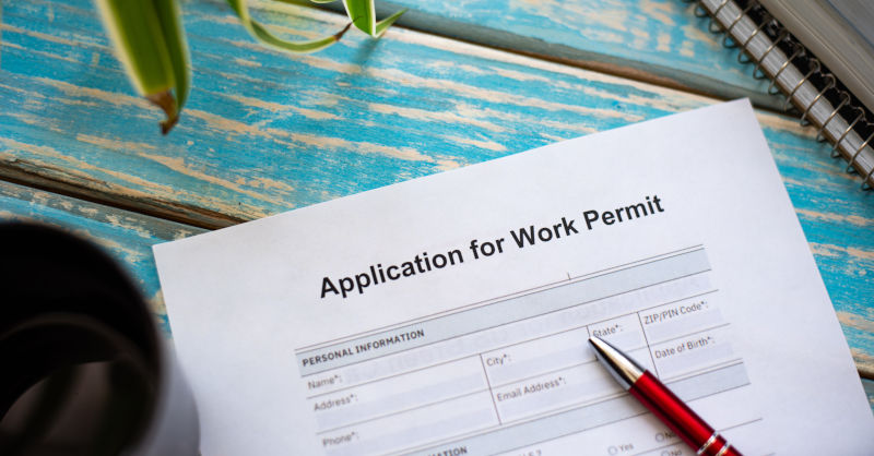 An application form for a work visa lying on a table